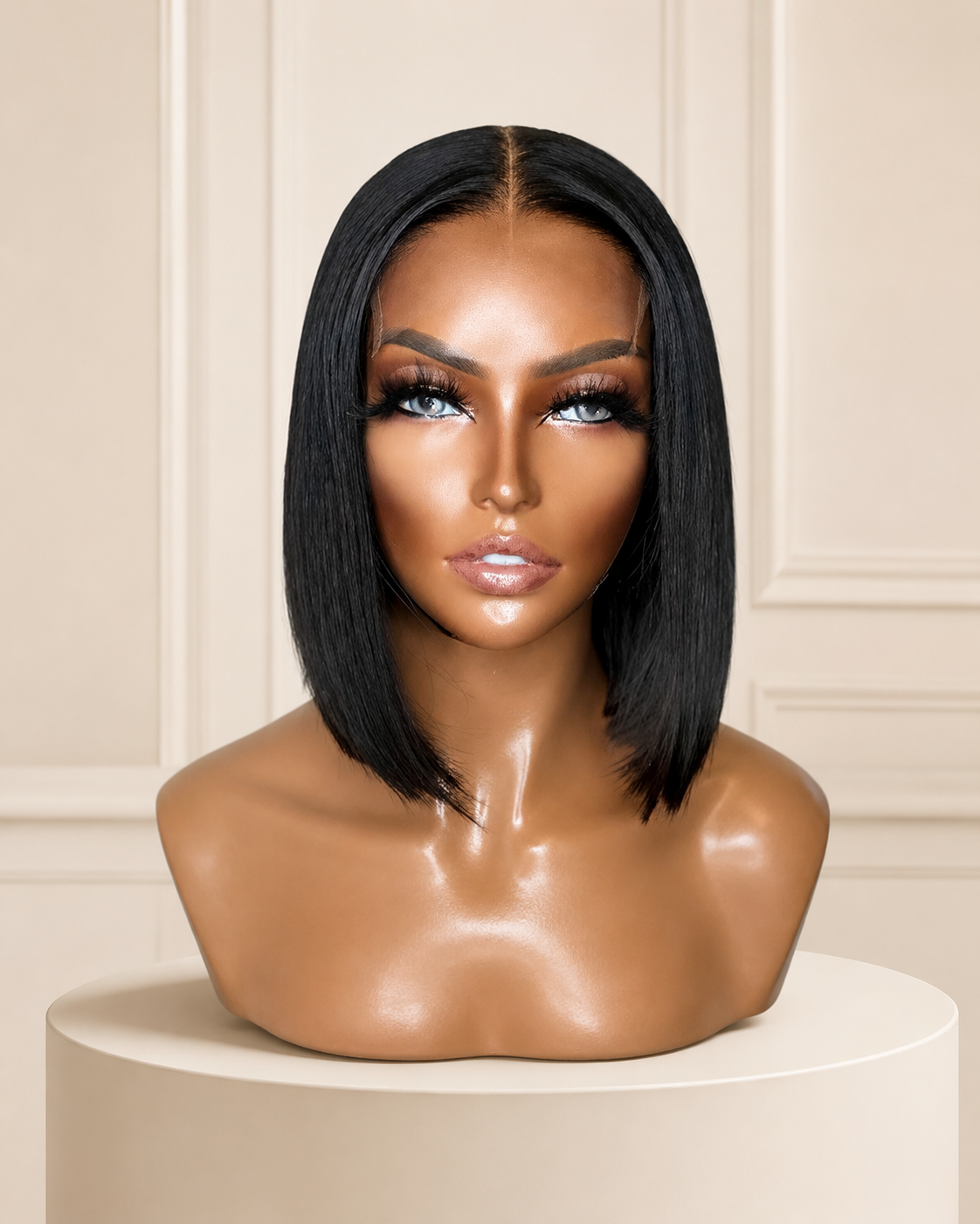 Jane natural black blunt bob wig on ivory pedestal